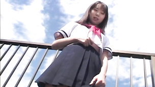 Japanese school girl caressing and finger banging her beaver