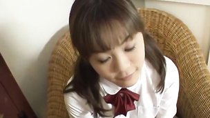 Innocent looking Japanese babe giving head to a stiff prick